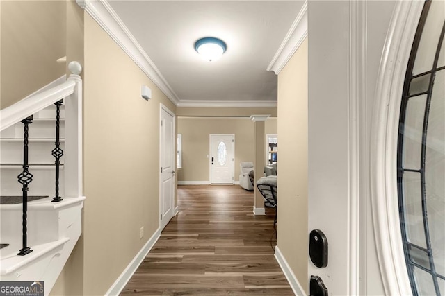 hall featuring hardwood / wood-style flooring and crown molding