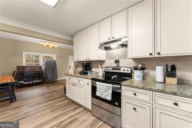 kitchen with stainless steel electric range, stone countertops, white cabinets, and decorative backsplash