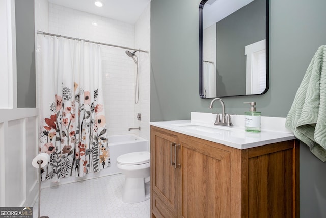 full bathroom with vanity, toilet, and shower / tub combo