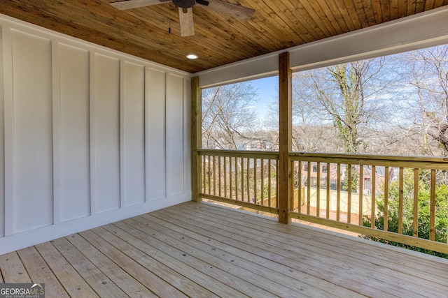 wooden terrace featuring ceiling fan