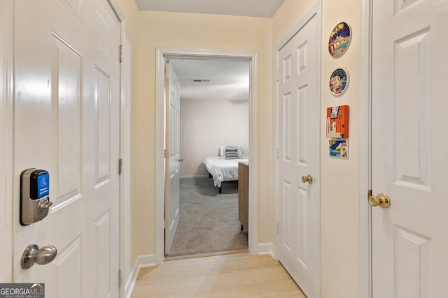 hallway featuring light wood-type flooring