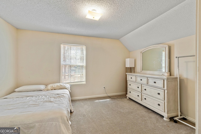 bedroom with lofted ceiling, light carpet, and a textured ceiling