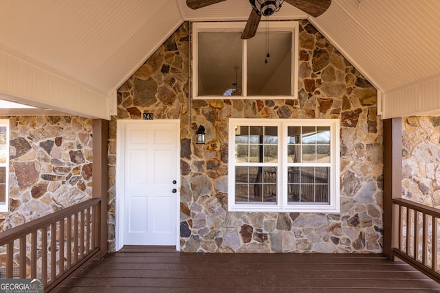 entrance to property with ceiling fan