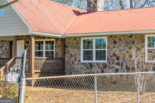 243 College St, Yatesville, GA 31097 - view of property exterior featuring stone siding and a chimney