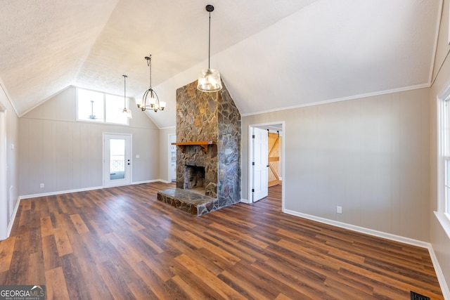 unfurnished living room featuring a fireplace, lofted ceiling, and dark hardwood / wood-style flooring