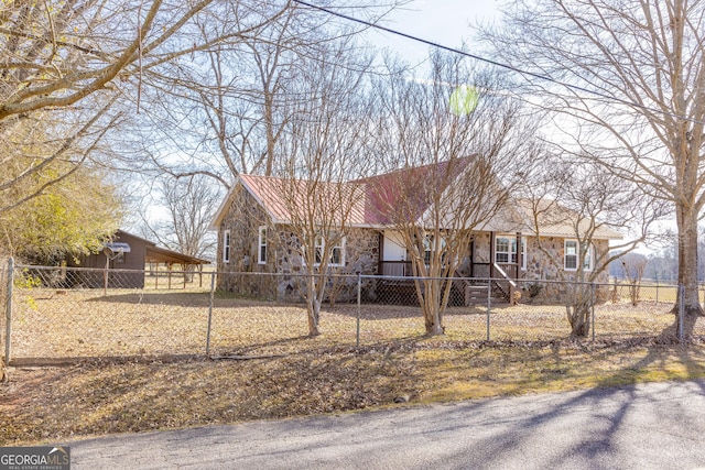 243 College St, Yatesville, GA 31097 - ranch-style home featuring stone siding and a fenced front yard