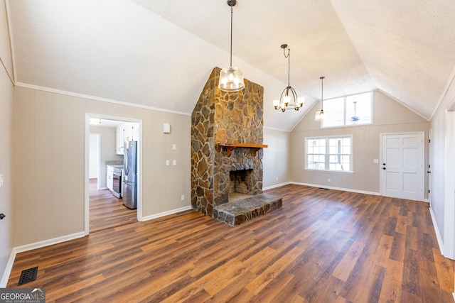 243 College St, Yatesville, GA 31097 - living room featuring lofted ceiling, dark wood finished floors, a stone fireplace, and baseboards