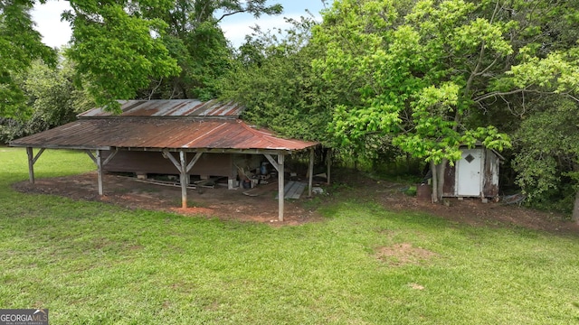 243 College St, Yatesville, GA 31097 - view of green lawn with an outbuilding and a shed