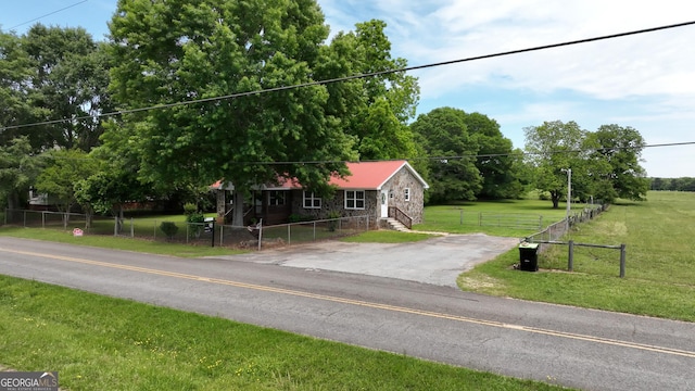 243 College St, Yatesville, GA 31097 - view of front of home with stone siding and asphalt driveway