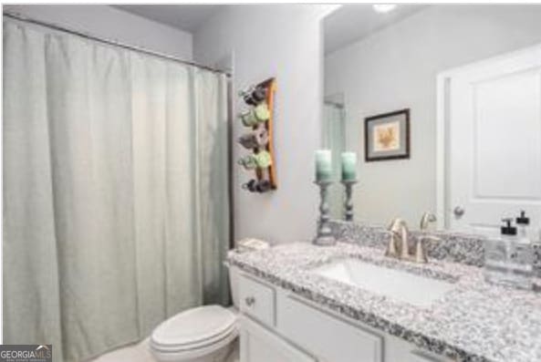 bathroom with vanity and toilet