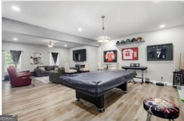 recreation room with light wood-type flooring and billiards