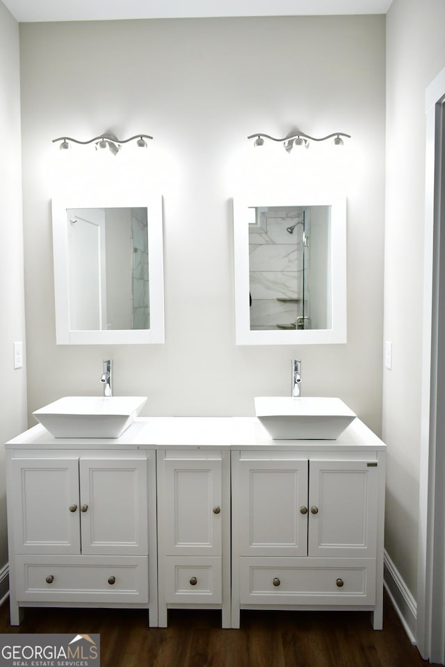 bathroom with vanity and hardwood / wood-style floors