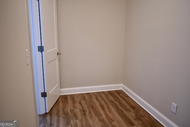 unfurnished room featuring hardwood / wood-style flooring