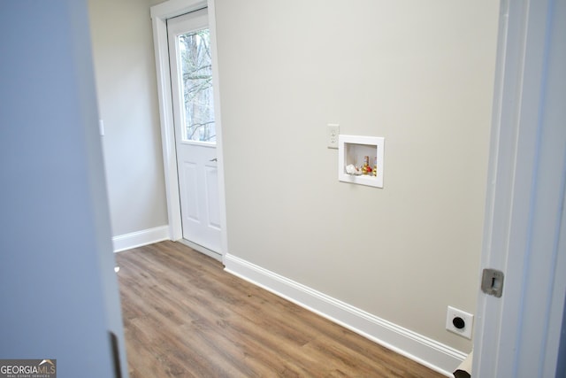 laundry area with wood-type flooring, electric dryer hookup, and washer hookup