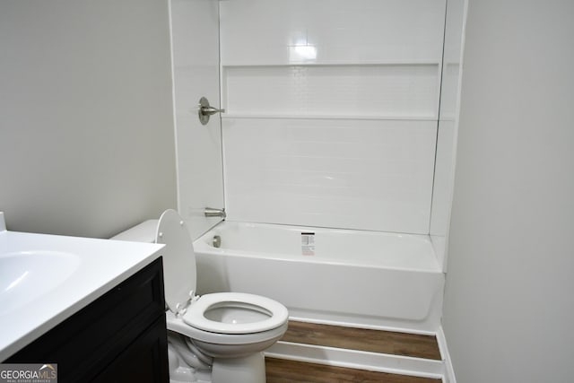 full bathroom with bathtub / shower combination, vanity, toilet, and wood-type flooring