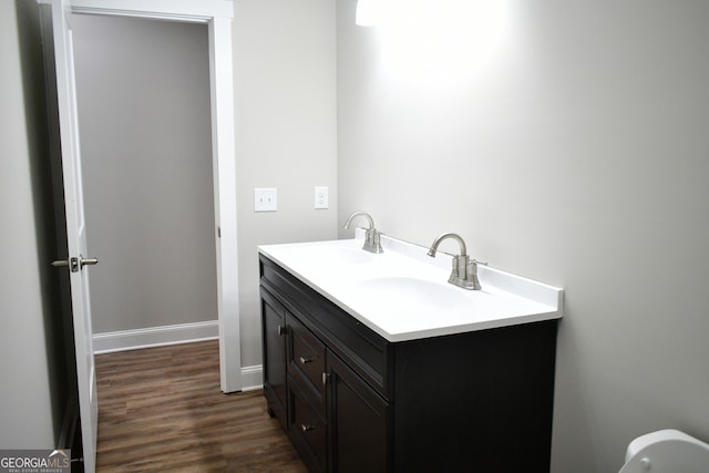 bathroom featuring vanity and hardwood / wood-style floors