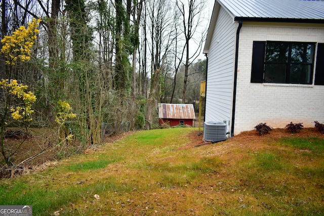 view of yard with central AC