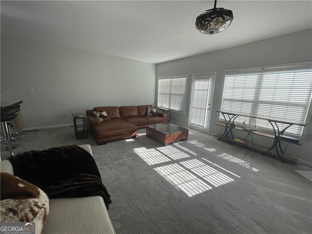 living room featuring a healthy amount of sunlight and carpet floors