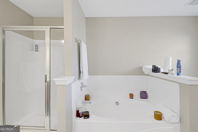 full bathroom with a stall shower, visible vents, and a bath