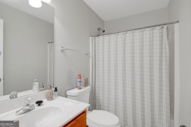 full bathroom with vanity and toilet