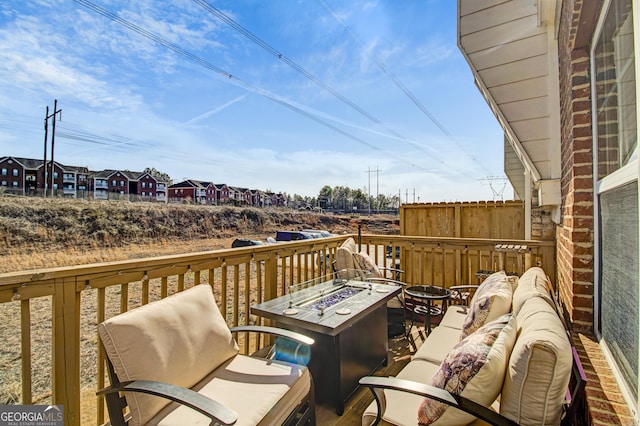 wooden terrace with a fire pit