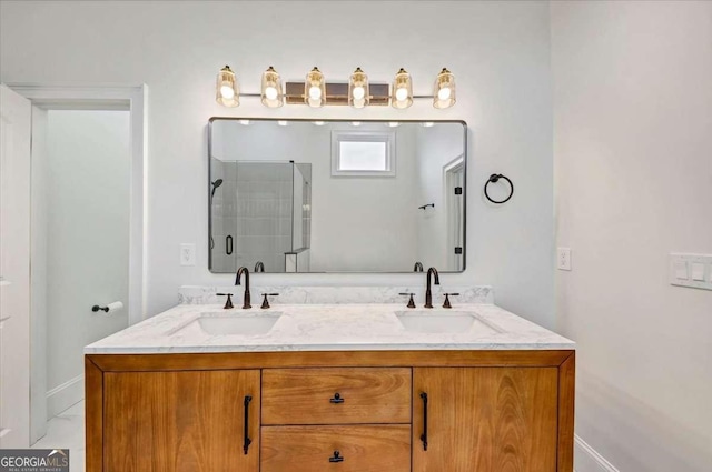 bathroom featuring vanity and a shower with door