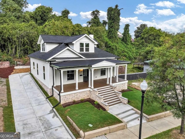 view of front of home featuring a porch and a front yard