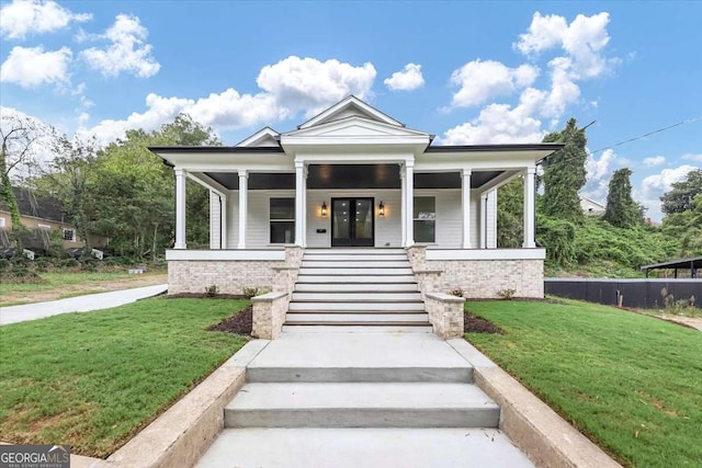 neoclassical / greek revival house featuring a porch and a front yard