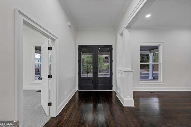 entryway with french doors, ornamental molding, and dark hardwood / wood-style floors