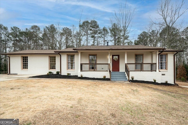 3308 Wildwood Dr SW, Marietta, GA 30060 - ranch-style house with a front lawn, covered porch, and brick siding