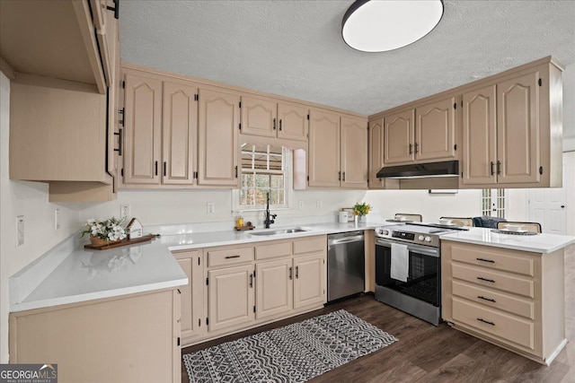 3308 Wildwood Dr SW, Marietta, GA 30060 - kitchen with stainless steel appliances, dark wood-type flooring, under cabinet range hood, a textured ceiling, and a sink