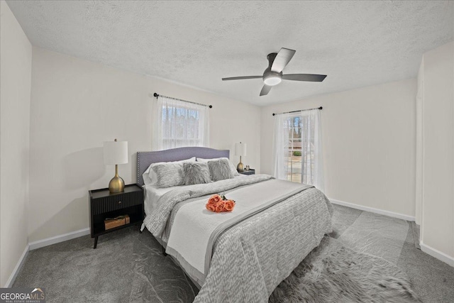 3308 Wildwood Dr SW, Marietta, GA 30060 - carpeted bedroom featuring multiple windows, baseboards, and a ceiling fan