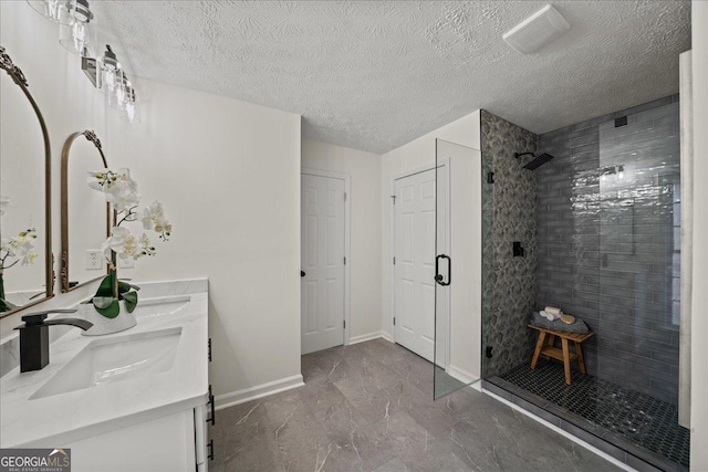 3308 Wildwood Dr SW, Marietta, GA 30060 - bathroom with tiled shower, a sink, marble finish floor, baseboards, and double vanity