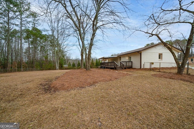 3308 Wildwood Dr SW, Marietta, GA 30060 - view of yard featuring a deck and fence