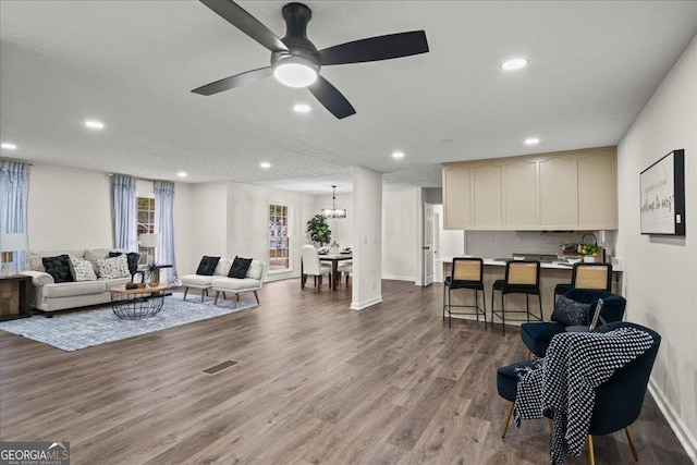 3308 Wildwood Dr SW, Marietta, GA 30060 - living area featuring recessed lighting, ceiling fan with notable chandelier, and wood finished floors