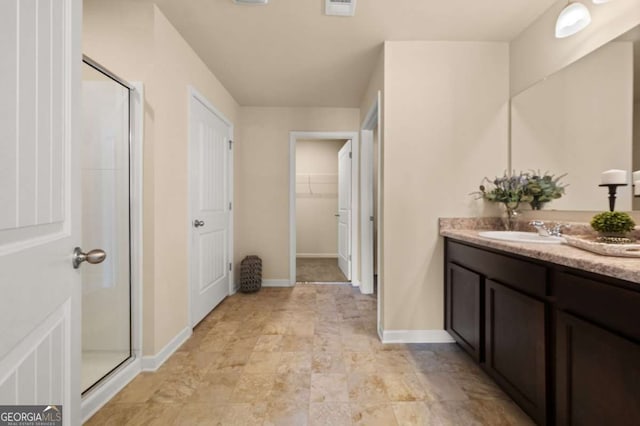 bathroom with vanity and walk in shower