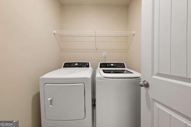 laundry area with washer and clothes dryer