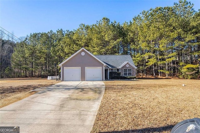 view of front of house with a garage and a front lawn