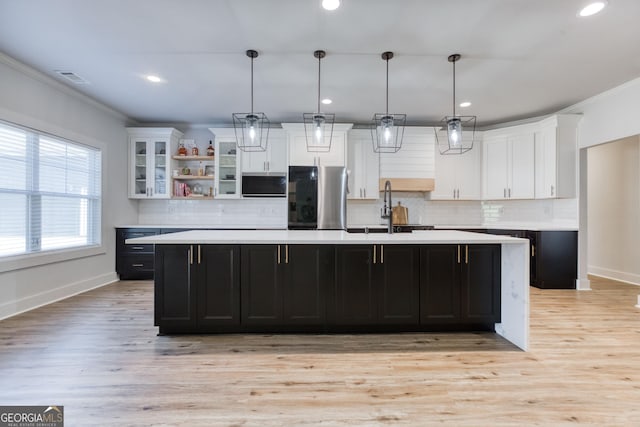 3166 Old Good Hope Rd, Good Hope, GA 30641 - kitchen featuring appliances with stainless steel finishes, a sink, light countertops, white cabinets, and ornamental molding
