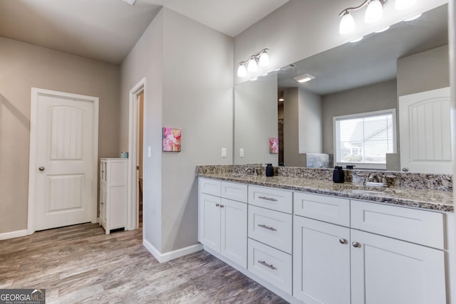 3166 Old Good Hope Rd, Good Hope, GA 30641 - bathroom with wood finished floors, baseboards, and double vanity