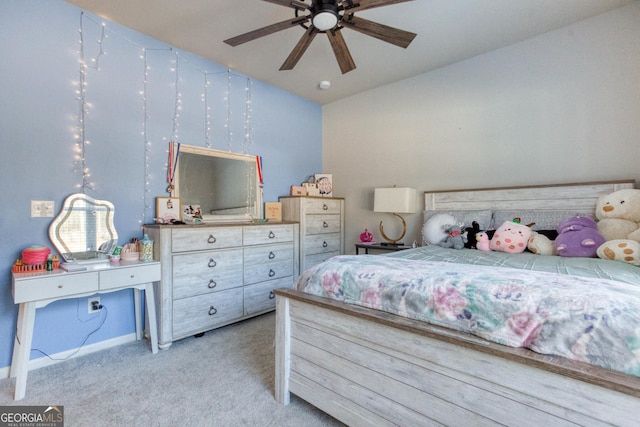 bedroom with ceiling fan and light carpet