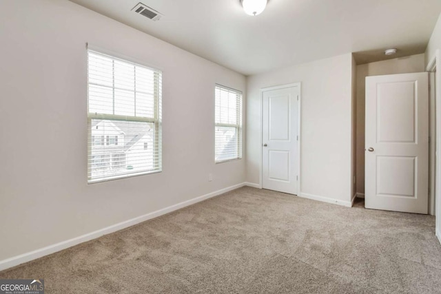 unfurnished bedroom with light carpet