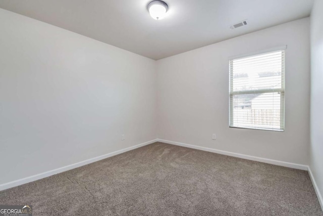 empty room with carpet flooring