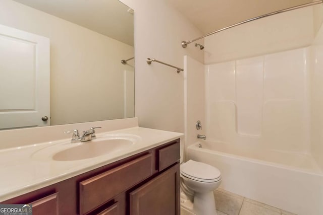 full bathroom featuring tile patterned flooring, vanity, shower / washtub combination, and toilet