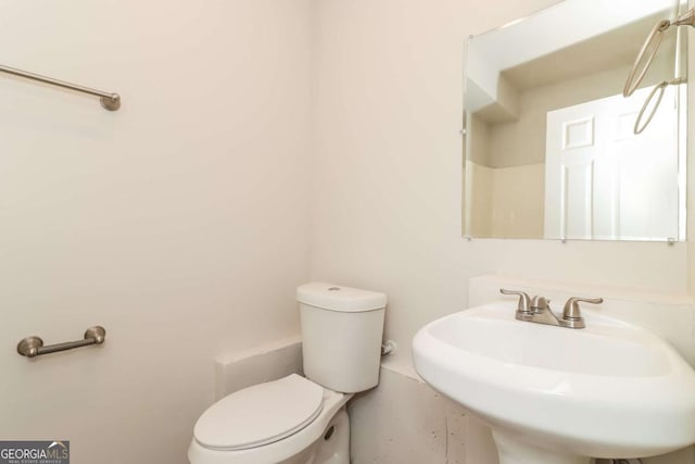 bathroom with toilet and sink