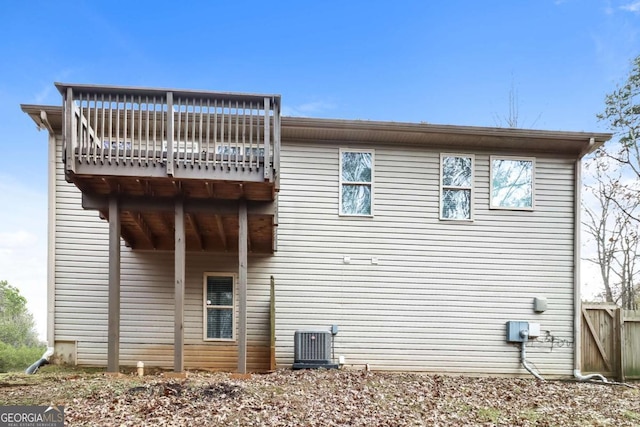 back of property featuring cooling unit