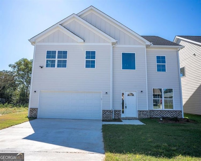 view of front of home featuring a garage and a front lawn