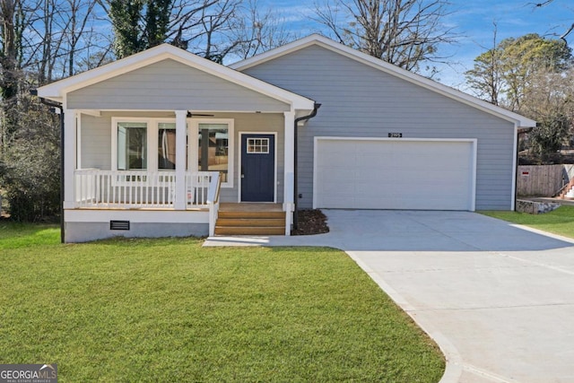 view of front of house featuring a garage, covered porch, and a front lawn