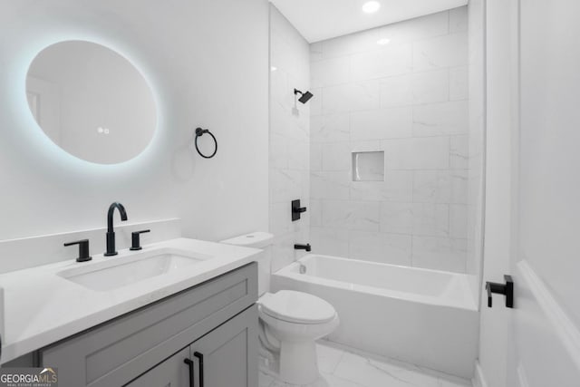 full bathroom with vanity, toilet, and tiled shower / bath combo