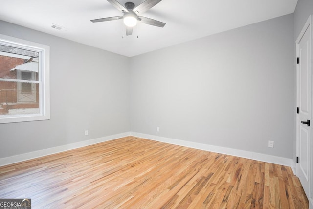 unfurnished room with ceiling fan and light hardwood / wood-style flooring